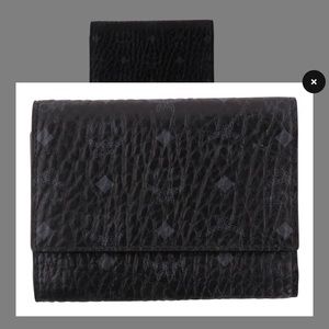 Gently used trifold black mcm wallet.
